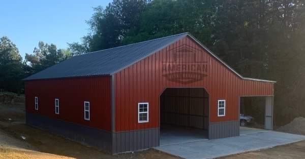 Metal barn with blue roof and sliding door